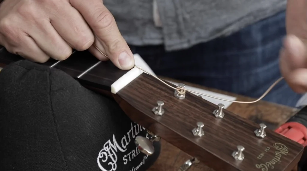 Experience Effortless Acoustic Guitar Restring With This Simple Trick